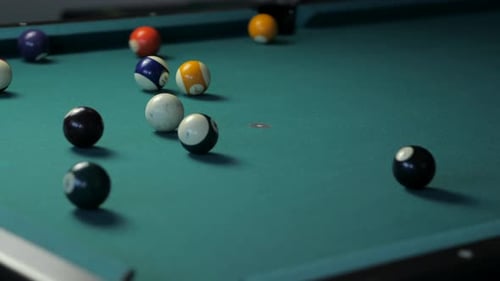 Medium Close Up of Golden Pool Break on Billiard Table