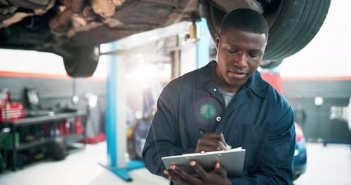 Mechanic, car and black man with clipboard, inspection and calibration with vehicle maintenance