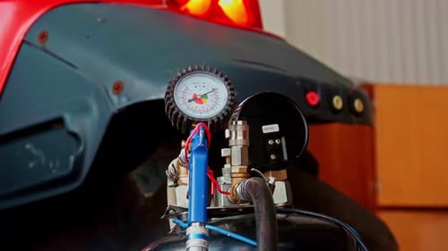 Detailed View of Industrial Pressure Gauge Setup Inside Workshop