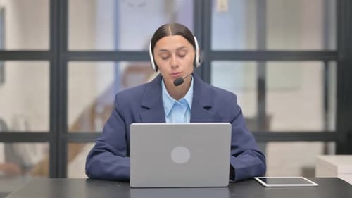 Mixed Race Woman with Headset Talking with Customer in Call Center