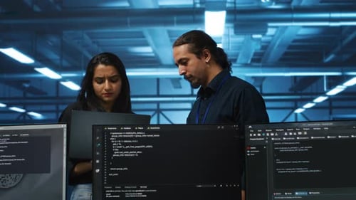 Admin in Server Hub Using Laptop to Present Manager Plan of Repairing Equipment