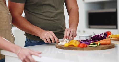 Couple Cooking Fresh Vegetables in Bright Kitchen