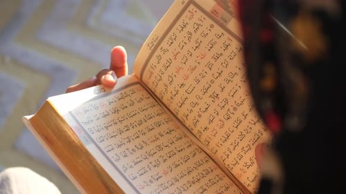 Muslim Women's Hand Reading Quran