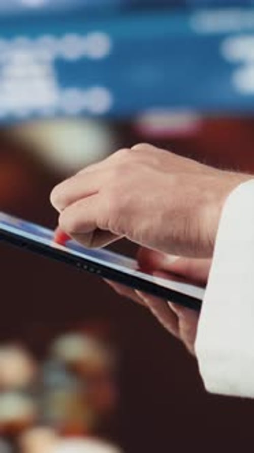 Hands Using Tablet at Modern Workplace