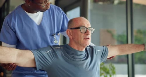 Nurse, help and old man in nursing home, stretching and physical therapy for pain relief