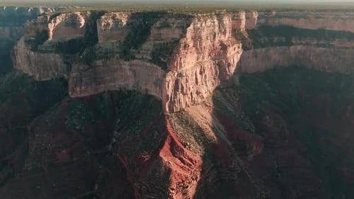 Aerial approach over deep gorge towards south rim of Grand Canyon.
