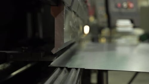 The Employee Hands are Not Bending the Large Parts of the Metal on the Bending Machine Closeup The