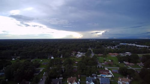 Aerial View of Suburban Homes Under Cloudy Sky