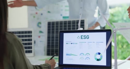 Closeup group diverse Asia businesspeople talk ESG strategies risk management workshop at office.