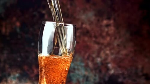 Amber Beer Poured into Glass Close-up