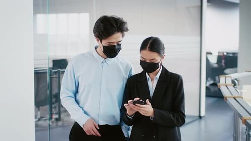 Young Professionals Collaborating in Modern Office During Pandemic