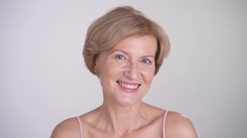 Smiling Blonde Woman Close-Up Portrait in Studio