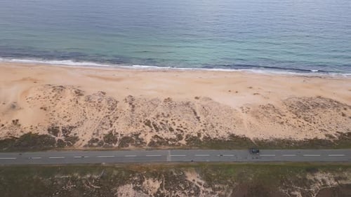 View of the Road Along the Sea Sandy Coast From the Drone