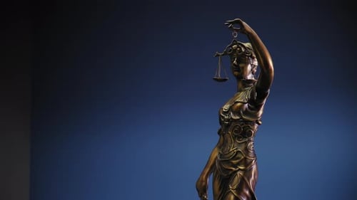 Legal and Law Concept Statue of Lady Justice on Blue Background Move Camera