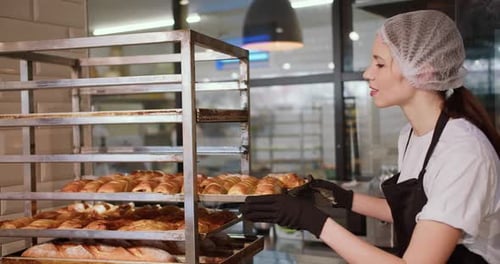Exquisite Bakery Creations Talented Female Kitchen Staff Showcasing Their Artistry in a Supermarket