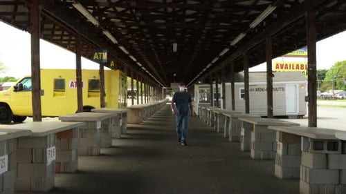 Young man walking alone at flea market with Protective mask Covid-19 spreading Outbreak. Health, Saf