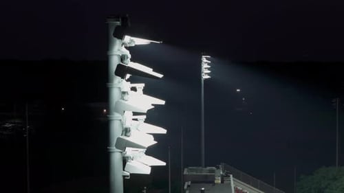 Light Tower of a Stadium and a Night City Close Up