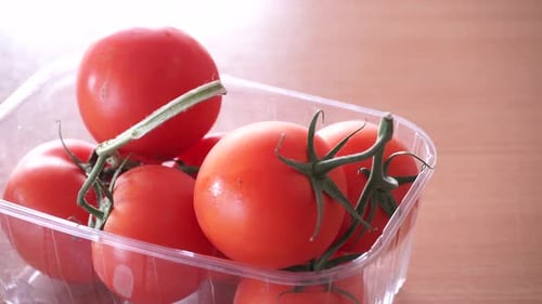 Red Tomatoes in Box on Table