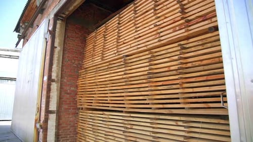 The pile of timber bricks stored in the warehouse.