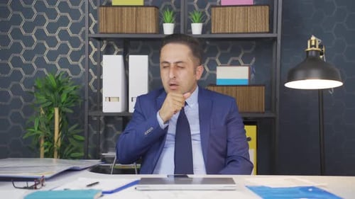 Man in Suit Coughing in Office