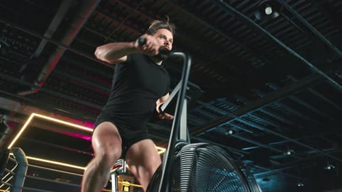 Athlete Engaged in Intense Indoor Cycling Workout