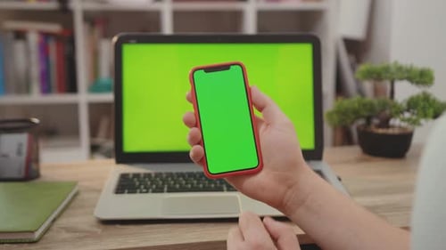 NEW YORK April 5 2019Close Up Hands Man Use Laptop Computer with Green Screen Chroma Key Display