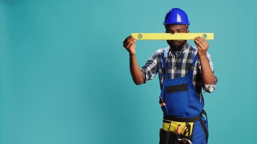 Young Adult Measuring Surface with Bench Level Tool