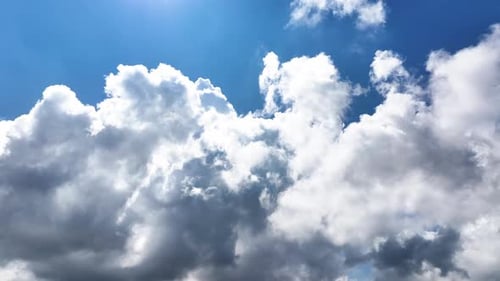Clouds Drifting Across the Bright Blue Sky