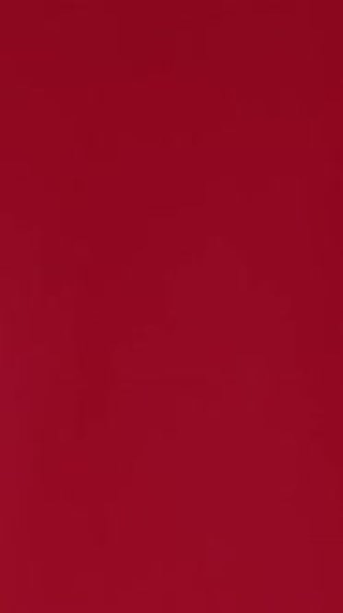 Hands Arranging White Gift Box with Red Ribbon