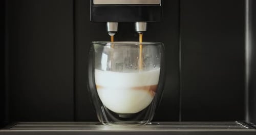 Close Up of Automatic Coffee Machine Pours Coffee Into Mug at Home Hot Coffee Drink Concept