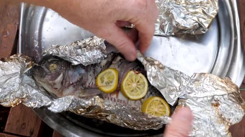 Cooked Fish with Lemon and Onion in Foil