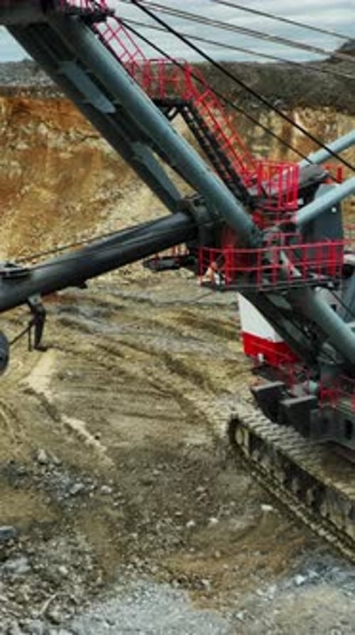 Large Excavator Digging in Open Pit Mine Stock Clip