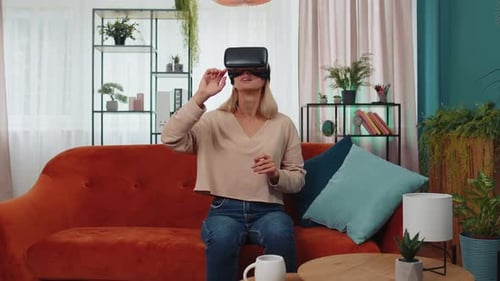 Young Woman Uses VR Headset at Home