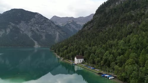 Lake in Tyrol Austria clear still water early morning drone view