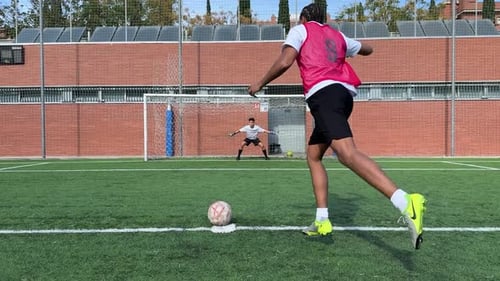 Soccer Player Scoring a Penalty Kick Goal