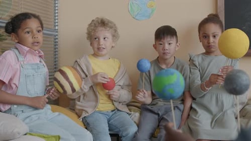 Little Children Having Astronomy Lesson in Elementary School