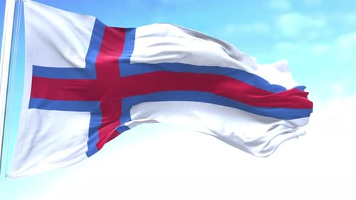 Faroe Islands National Flag Waving Against Blue Sky