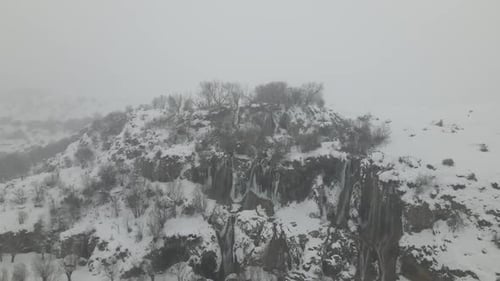 Aerial View of Frozen Waterfall in Winter