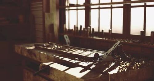 Woodworking Tools and Workspace Illuminated By Warm Sunlight in a Workshop