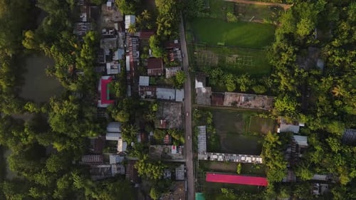 Aerial birdseye view descending above Sylhet slum buildings in Bangladesh