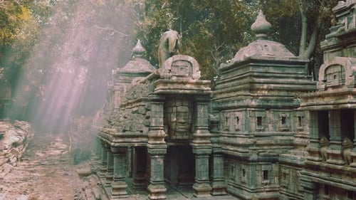 Ancient Cambodian Temple Ruins Amid Sunlit Tree Filled Surroundings