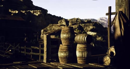 Old Western Scene with Wooden Barrels and Mountains