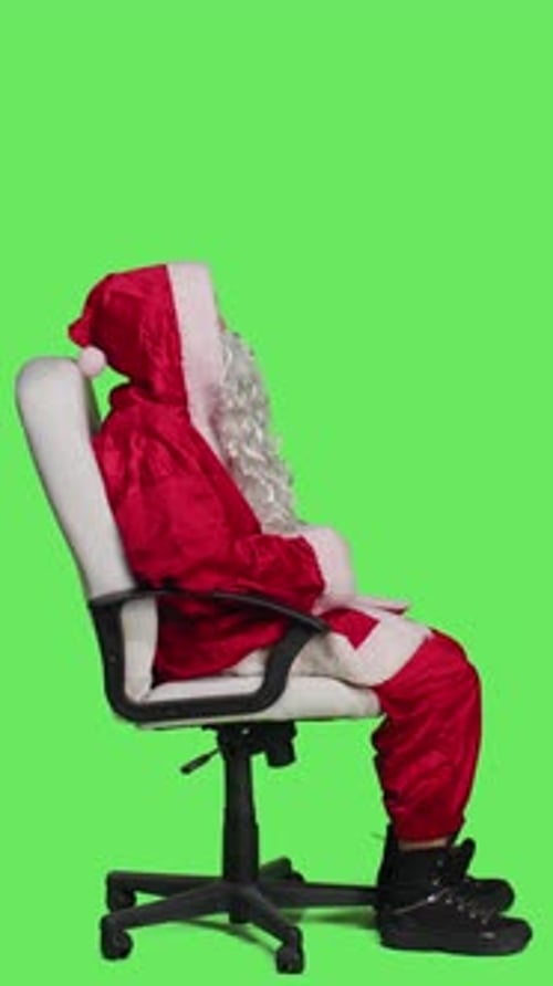 Vertical Video Profile of Saint Nick Embodiment Sitting on Chair