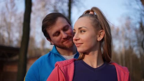 Happy Couple Kissing in Park