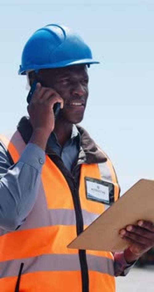 Construction, clipboard or black man with phone call for negotiation, material delivery