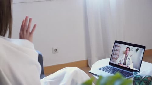 Woman Telemedicine Call with Doctor on Laptop