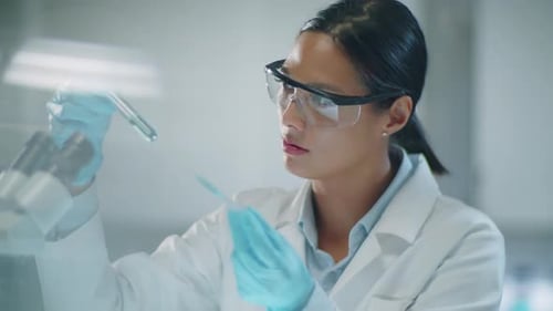 Woman Scientist Working with Test Tubes in Lab