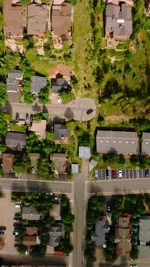 Sunlit view of beautiful cozy little town of United States. Drone footage over the nice cottages