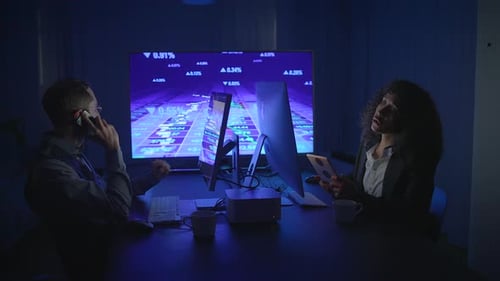 Business People Working in Dark Conference Room