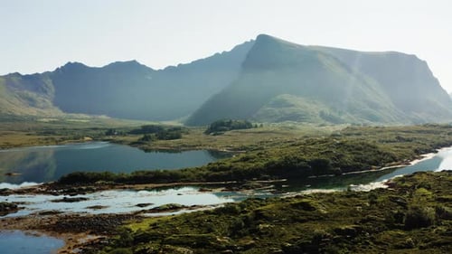 Lake's Still Waters And Mountain Range